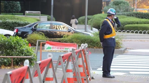 A TEMP WORKER WORKS AT CONSTURCTION SITE ON THE STREET IN JAPAN Stock Footage 59922339