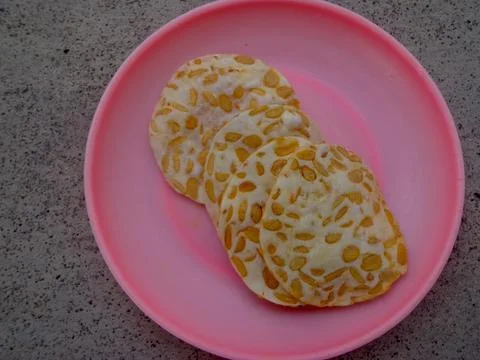Tempe chips made from thin slices of fried tempeh Stock Photos