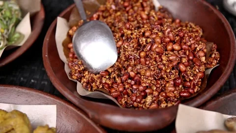 Tempeh orek fried peanuts with soy sauce typical of Indonesia Stock Footage 272298576
