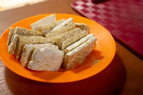 Tempeh in a plastic container Stock Photos