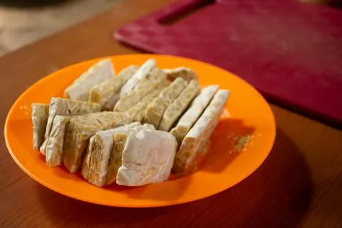 Tempeh in a plastic container Stock Photos