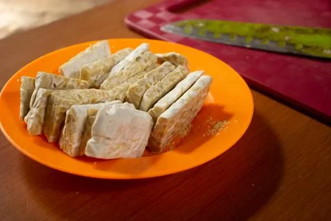 Tempeh in a plastic container Stock Photos