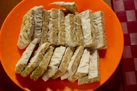 Tempeh in a plastic container Stock Photos