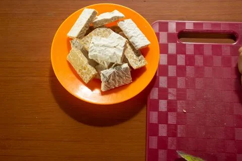 Tempeh in a plastic container Stock Photos