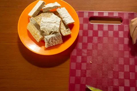 Tempeh in a plastic container Stock Photos