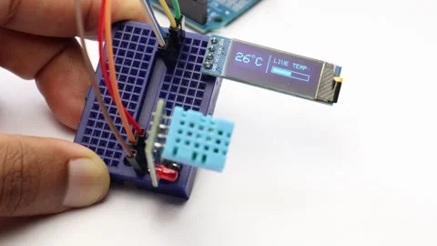 Temperature and humidity sensor displaying readings on oled display Stock Footage 341538922