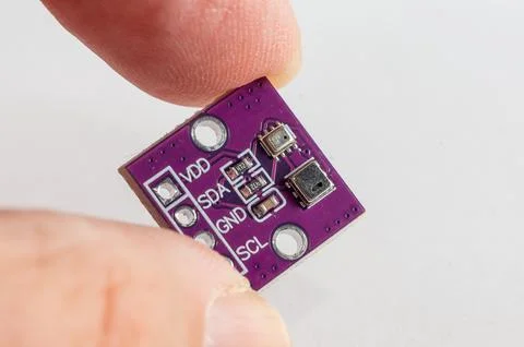 Temperature and pressure sensor for a DIY smart home held in hand Foto stock