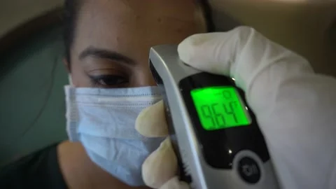 Temperature check Thermal screening customer, protection spread Covid 19 corona. Video stock 130180939