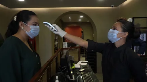 Temperature check Thermal screening customer, protection spread Covid 19 corona. Video stock 130180989