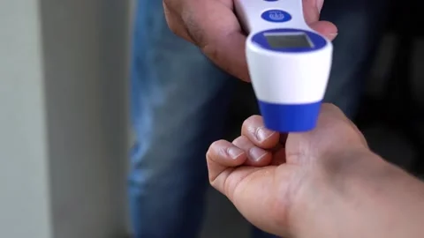 Temperature checking at hands, with posi... | Stock Video | Pond5
