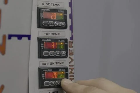 Temperature control panel. Dashboard Worker Pressing Buttons Stock Photos