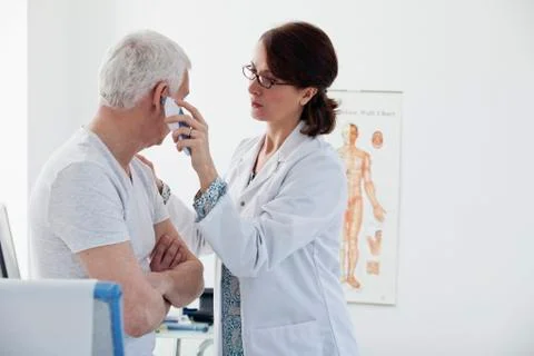 Temperature elderly person Stock Photos