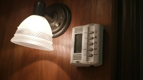 Temperature gauge next to a light Stock Footage 106591226