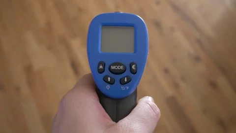 Temperature gun reading interior of home, 4k 動画素材 81383552