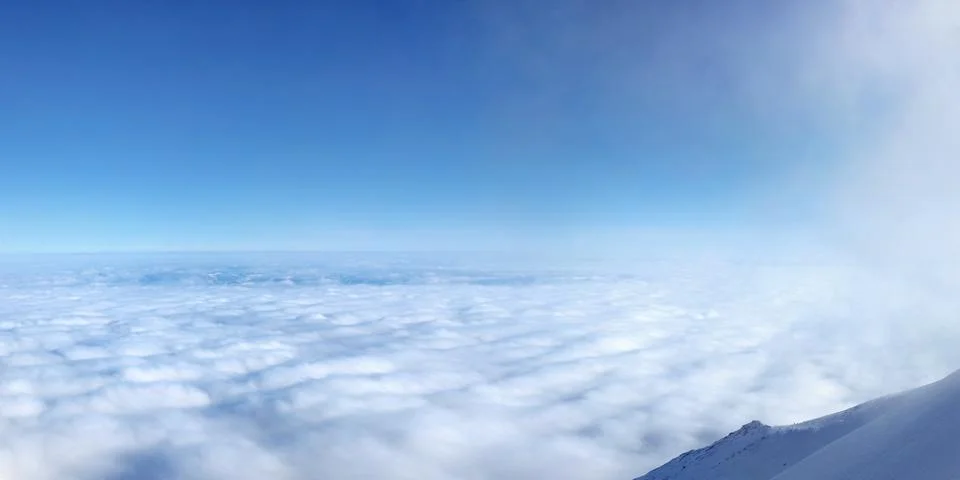 Temperature inversion forming sea of clouds seen from above, high in mountain Stock Photos