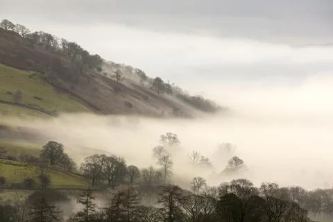 A temperature inversion leading to valley mist over Ambleside, Lake District, Stock Photos