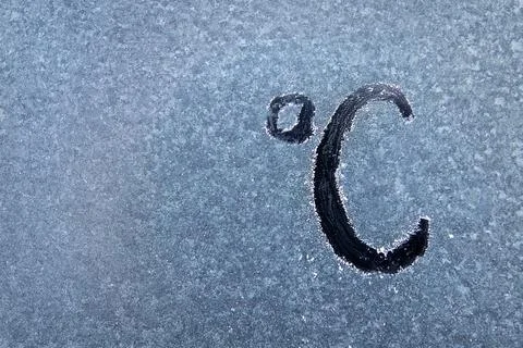 Temperature Marking in Degrees Celsius on a Textured Surface Showing Cold Stock Photos