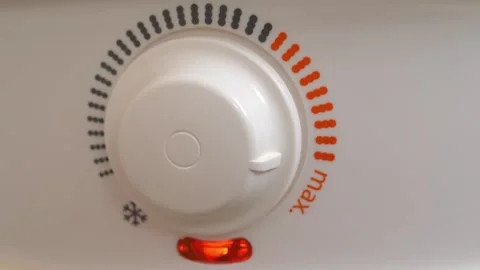Temperature regulator for heating cold water in boiler. Boiler has turned on Stock Footage 318961119