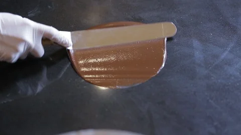Tempering chocolate temperature for using a marble Stock-Footage 94229266