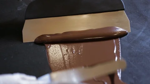 Tempering chocolate temperature for using a marble Video stock 94229283