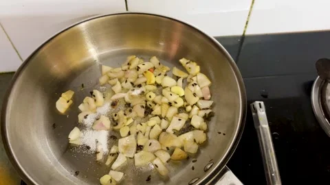 Tempering Garlic Onion And Cumin Seeds In Pan For Traditional Indian Recipe Base Stock-Footage 340955818