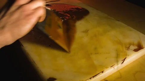 Tempering melted chocolate on table Stock Footage 79842994