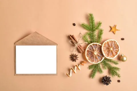 The template is a blank paper and an envelope with a place for text on a beig Stock Photos