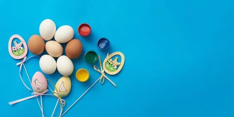 Template for easter holiday with eggs and paints and copy space Stock Photos