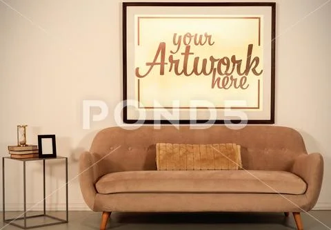 Template of empty sofa and picture frame in home PSD Template