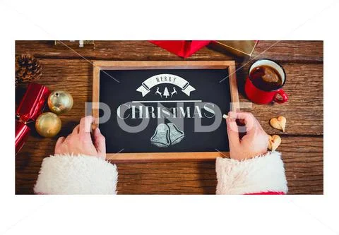 Template of Santa Claus holding a slate with Merry Christmas text PSD Template