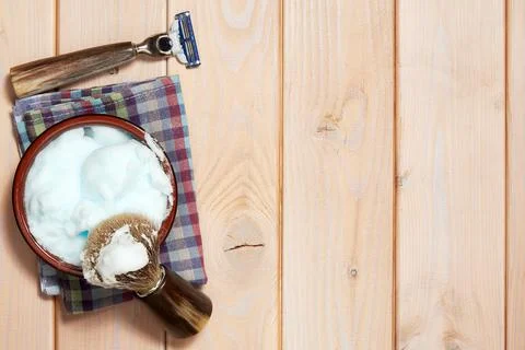 Template with shaving tools, razor blade, brush and gel on the wooden surface Stock Photos
