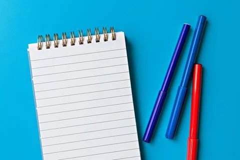 Template for text and design. empty white notepad and multi-colored markers Фото