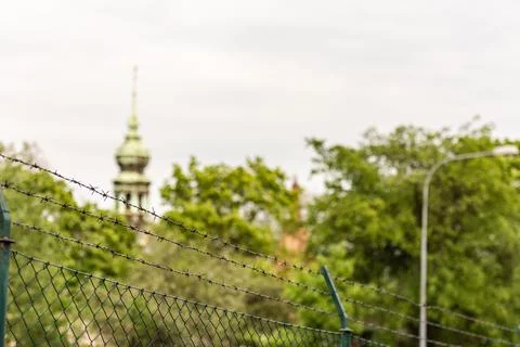The temple behind the barbed wire Stock Photos