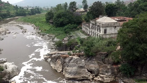 Temple Beside a Polluted River Stock Footage 108973509