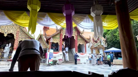 Temple complex with decorative lanterns and people exploring the grounds Stock Footage 321524405