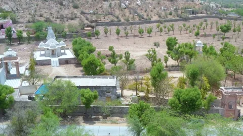 Temple Complex with Domes and Rocky Terrain Stock Footage 322977500