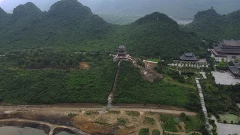 Temple complex, pagodas next to forest and mountains Stock Footage 242094296