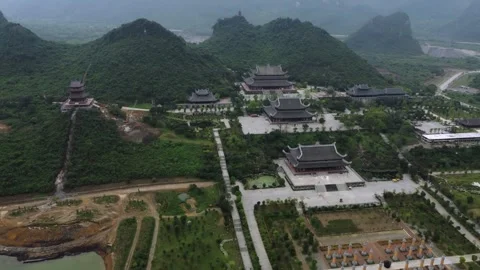 Temple complex, pagodas next to forest and mountains Stock Footage 242094390