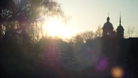 Temple with a dome in the warm rays of the sun with the grass and amazing bokeh Видео 317190947