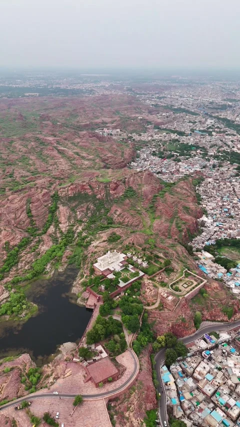 Temple drone footage with backdrop of Rajasthan’s blue city Stock Footage 310660364