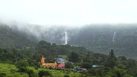 Temple in India with Waterfall in the background Drone shot 4K60 스톡 동영상 332893211