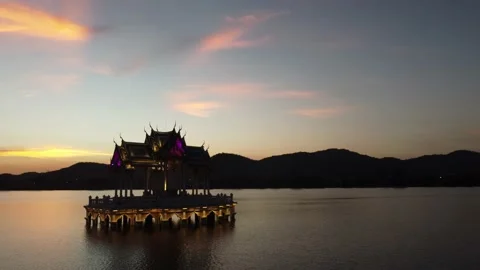 Temple on a lake at sunset with lights 動画素材 156278179