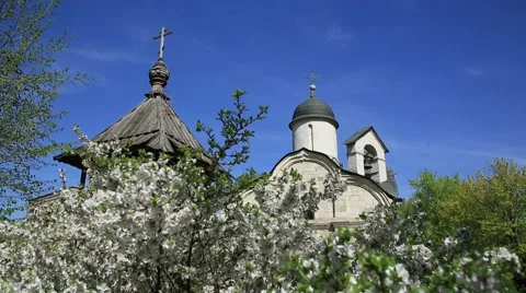 Temple Martyr Tryphon on the background of blossoming Apple trees. Stock Footage 52932601