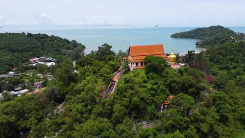 Temple on a mountain in Phuket surrounded by the jungle, view from above Stock Footage 166921906
