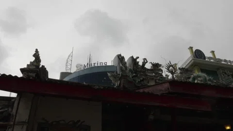 Temple rooftop against a cloudy sky in Bangkok Stock Footage 345859792