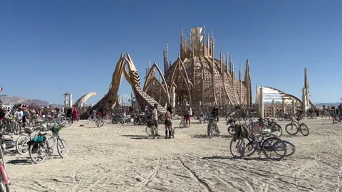 Temple of the Sacred Reflections at Burning Man Festival. People and Bicycles 스톡 동영상 312182409