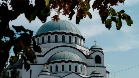 The Temple of Saint Sava in Belgrade framed by autumn leaves. The largest Stock Footage 316598276