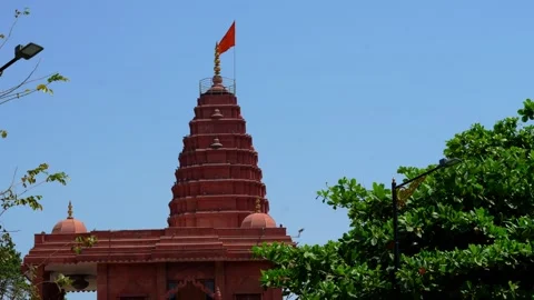 Temple Shikhara Rising Above Trees Under Clear Sky in Ujjain 스톡 동영상 336884151