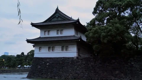 The temple on the side of the tree in Imperial gardens in Tokyo Japan Stock Footage 121413690