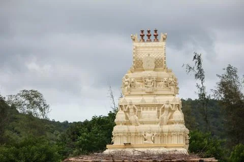 Temple tower along the mountain range of Talamalai Reserve Forest, Hasanur, T Stock Photos
